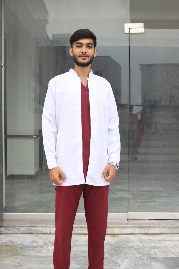 NEI student in clinical uniform